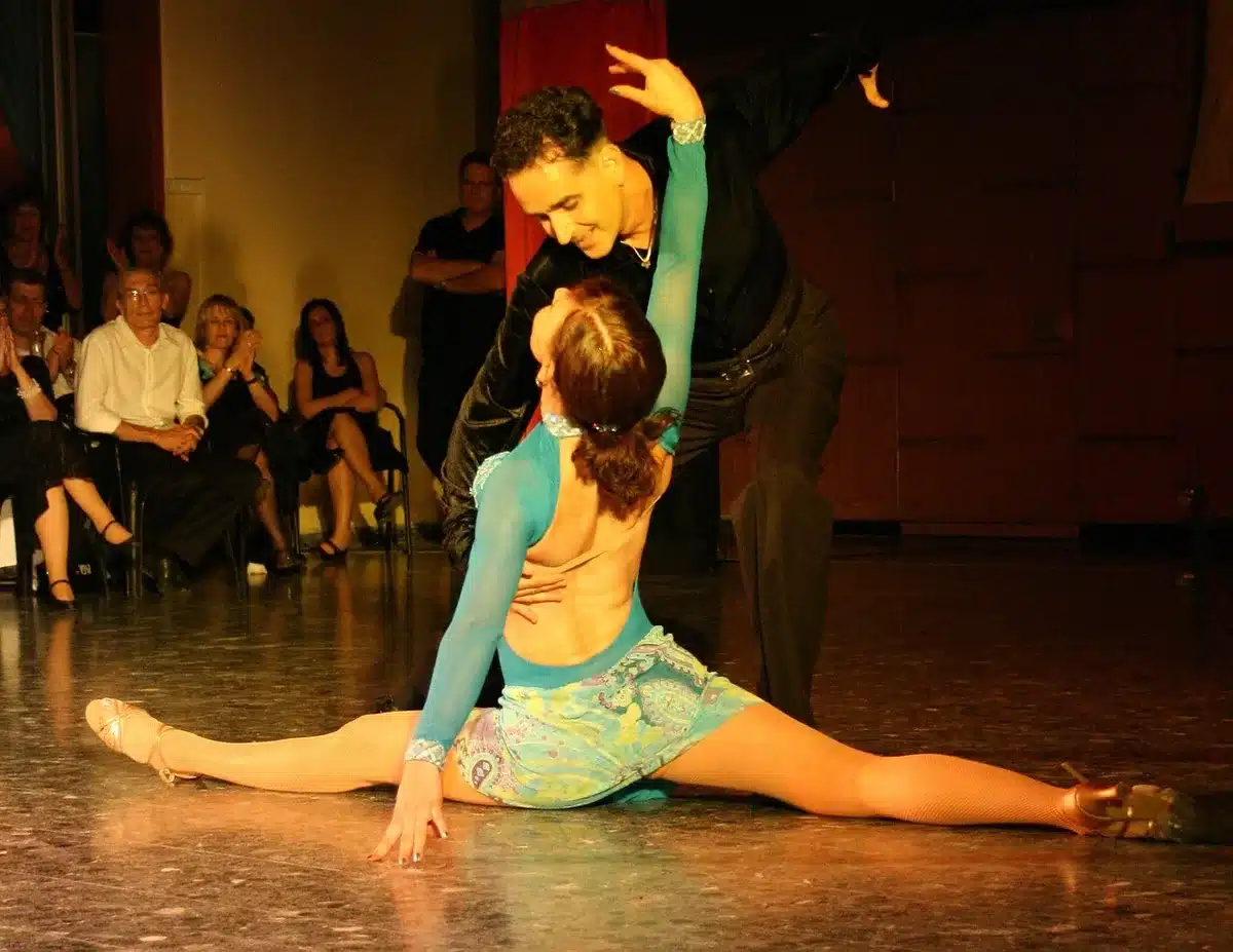 Judges and audience reacting to a performance in a dance studio setting