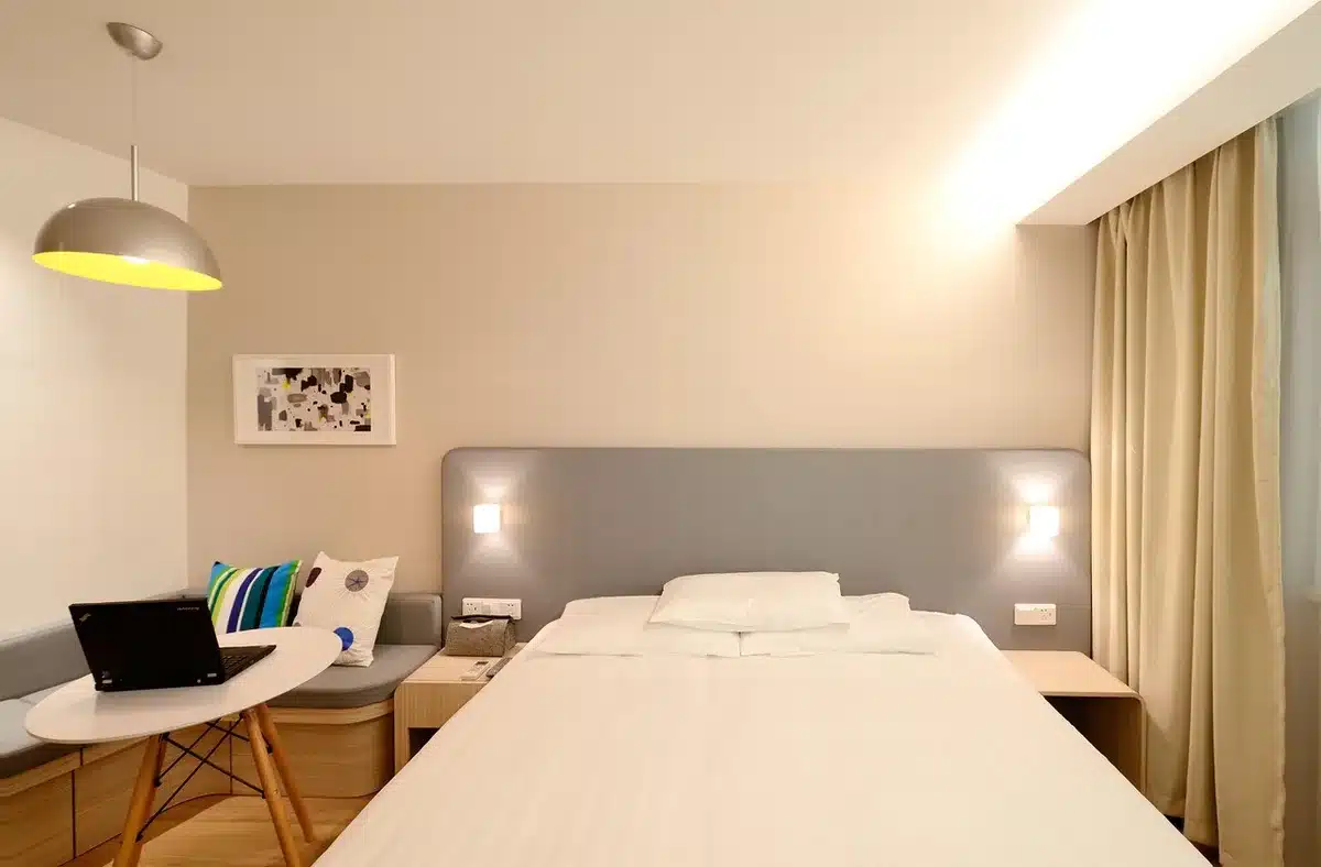 Creators filming short-form videos inside a hotel room during a stay