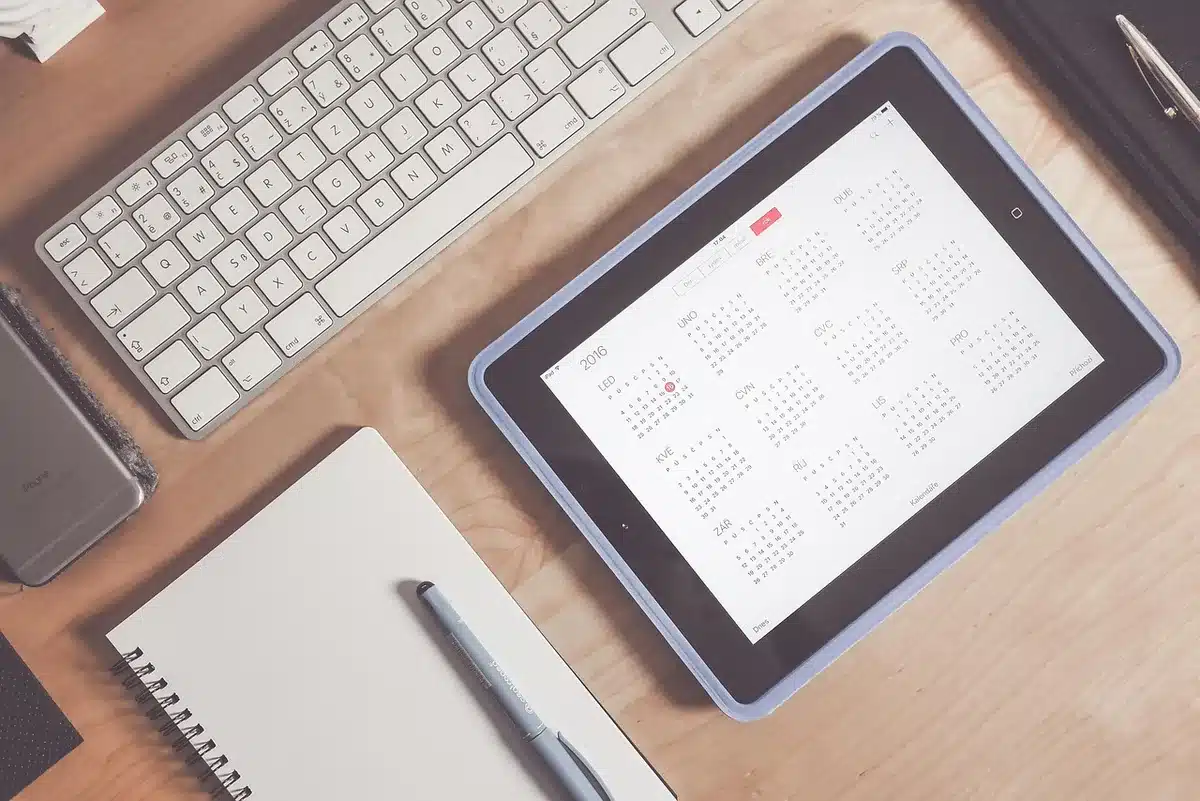 Host managing booking calendar and messages on a laptop