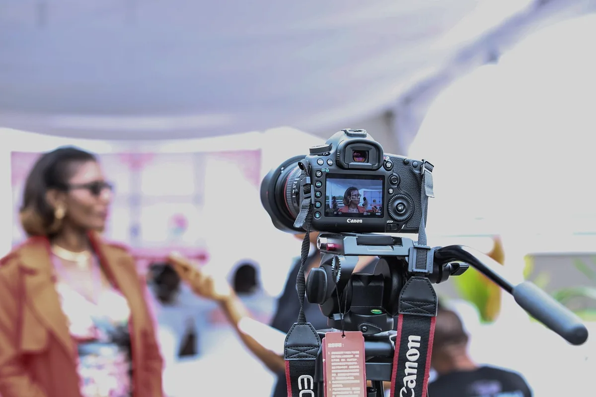 Behind-the-scenes shot of reality show cast chatting off-camera