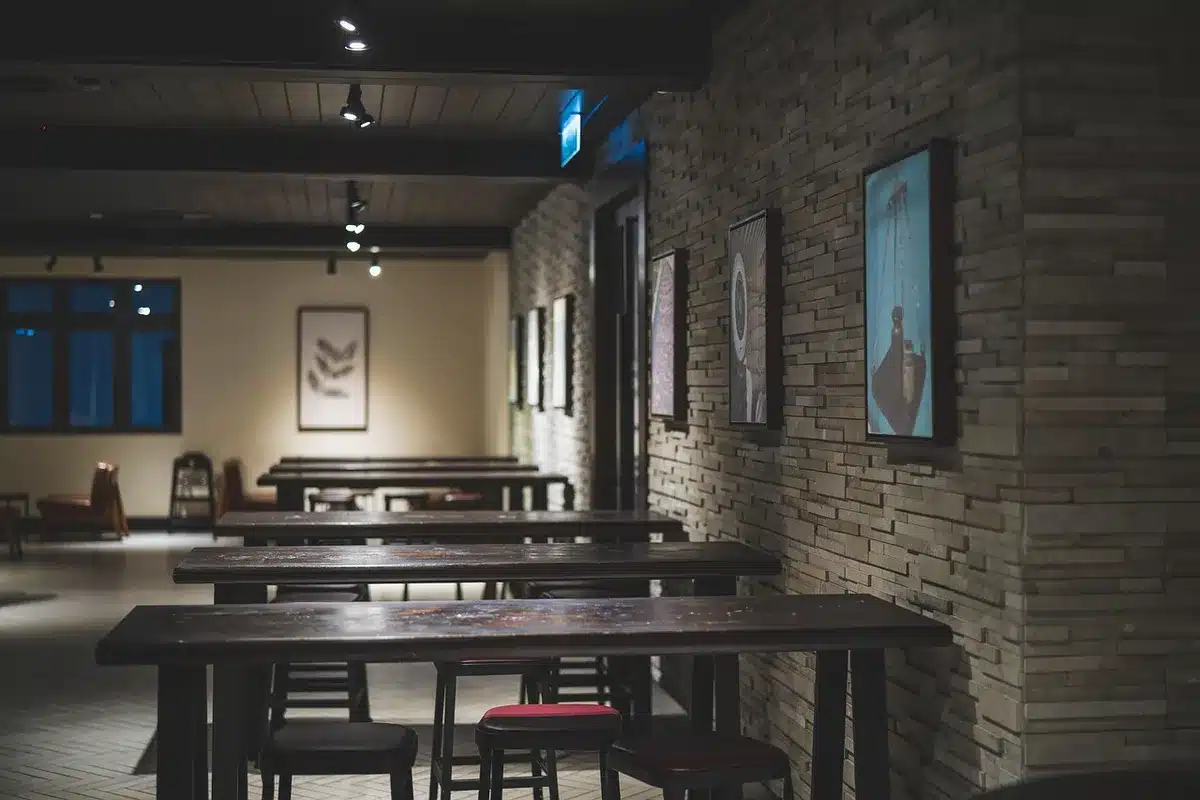 Cozy small family-run restaurant interior with tables and counter
