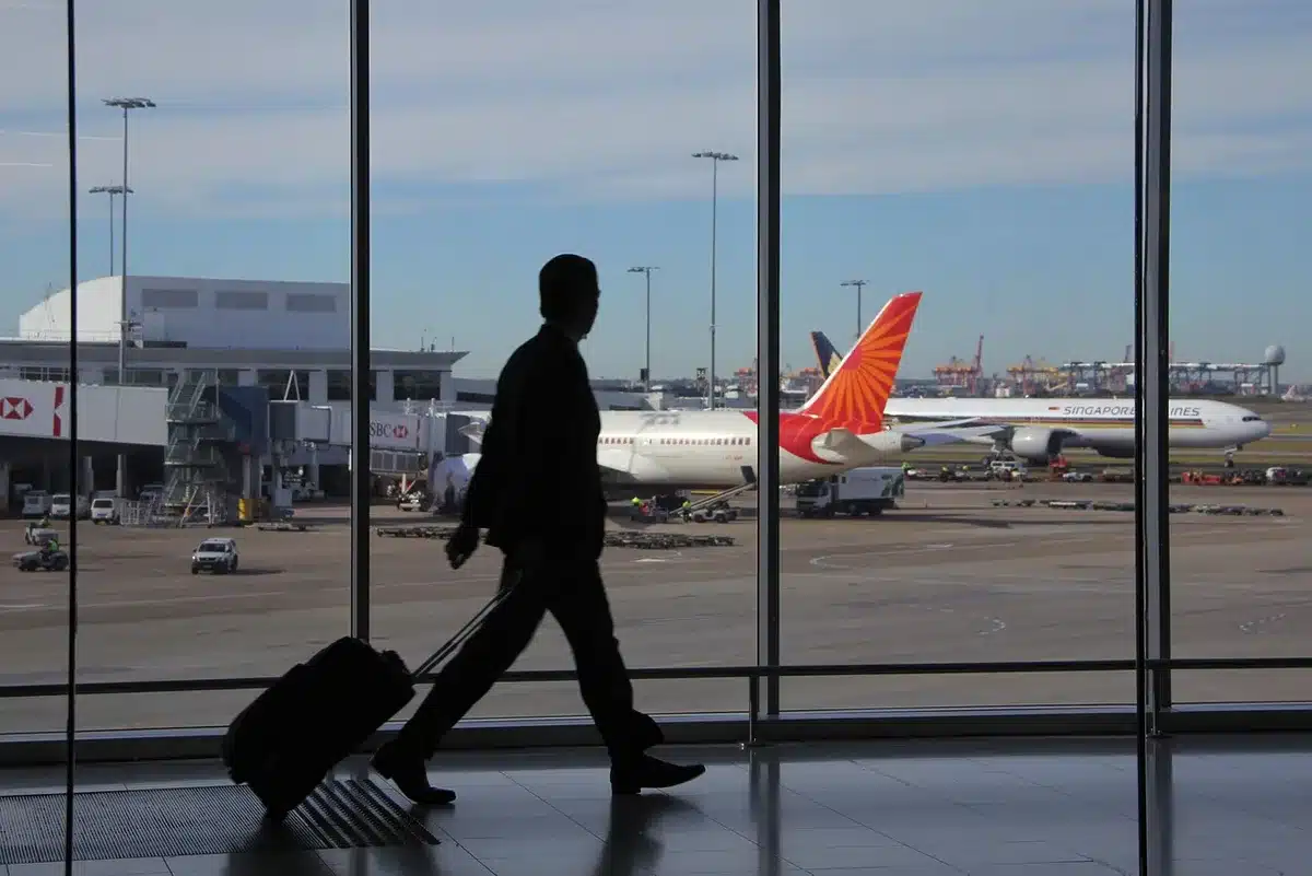 Passenger boarding a small jet at a regional Mexican airport