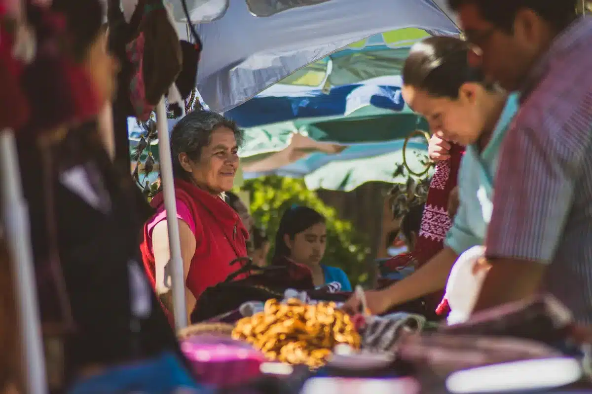 Vendor preparing seafood tacos at an outdoor market