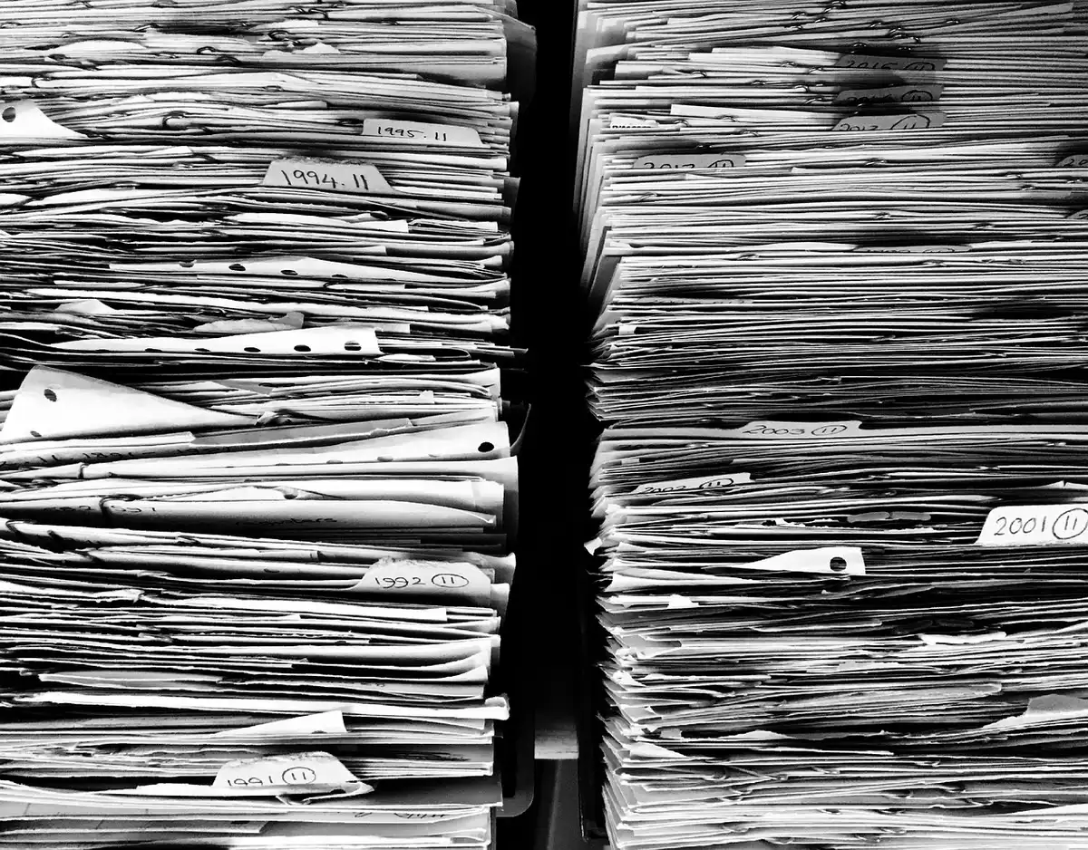 Close-up of contract papers and a basketball agent's hands