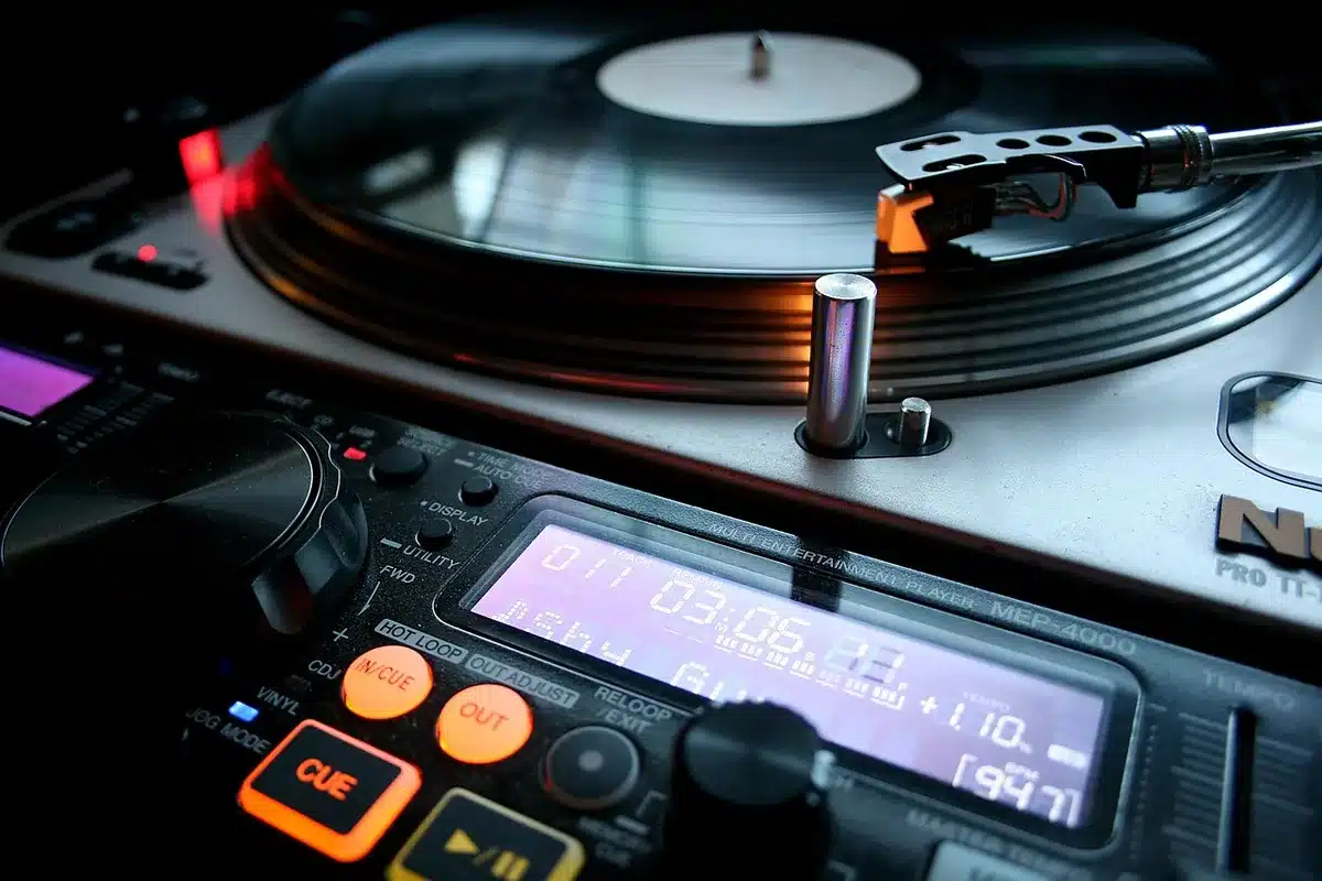 Close-up of a mixing desk and vinyl records representing new songs and production