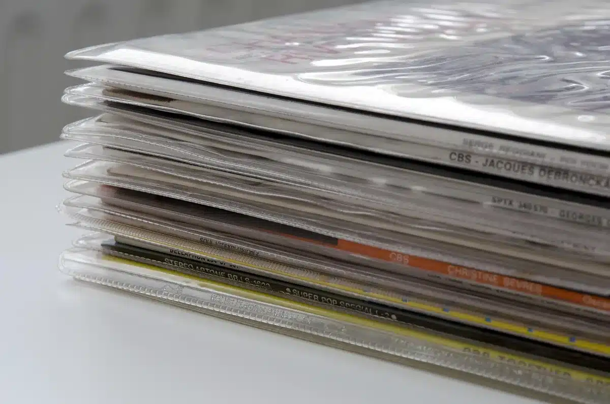 Stacks of different album editions and merchandise on display in a store