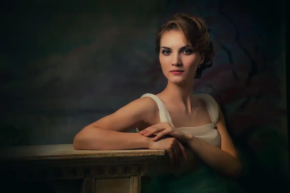 Close-up of soft curled hair and pale pink makeup on a model