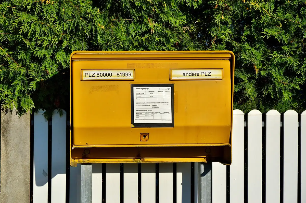 Close-up of a handwritten letter and a plain envelope