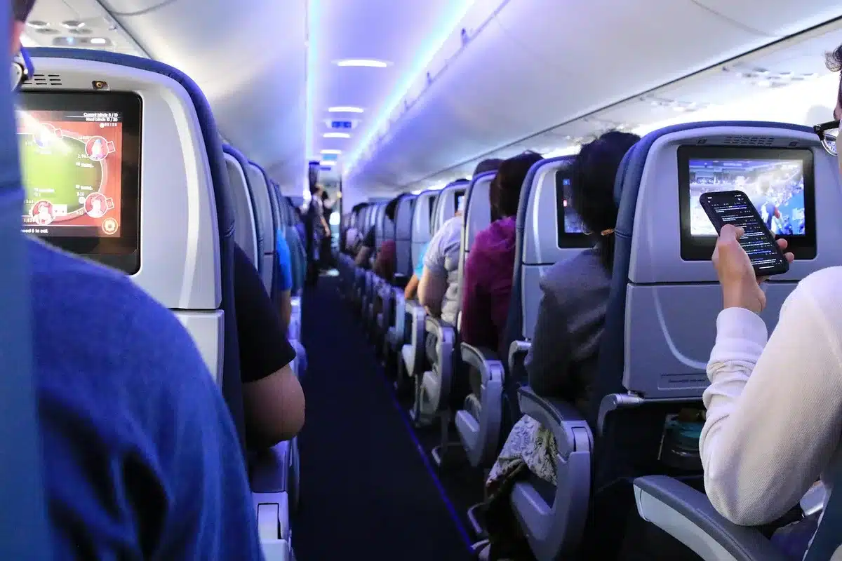 Tablet screen showing in‑flight Wi‑Fi connection in an airplane seat