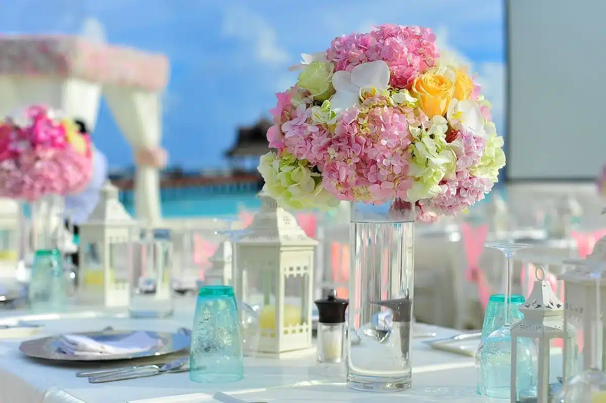 Resort beachfront dining area with tables and ocean view