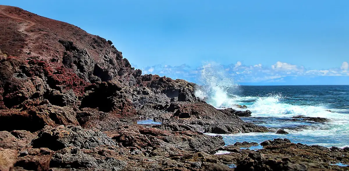 Sunny Canary Islands beach with people in light clothing