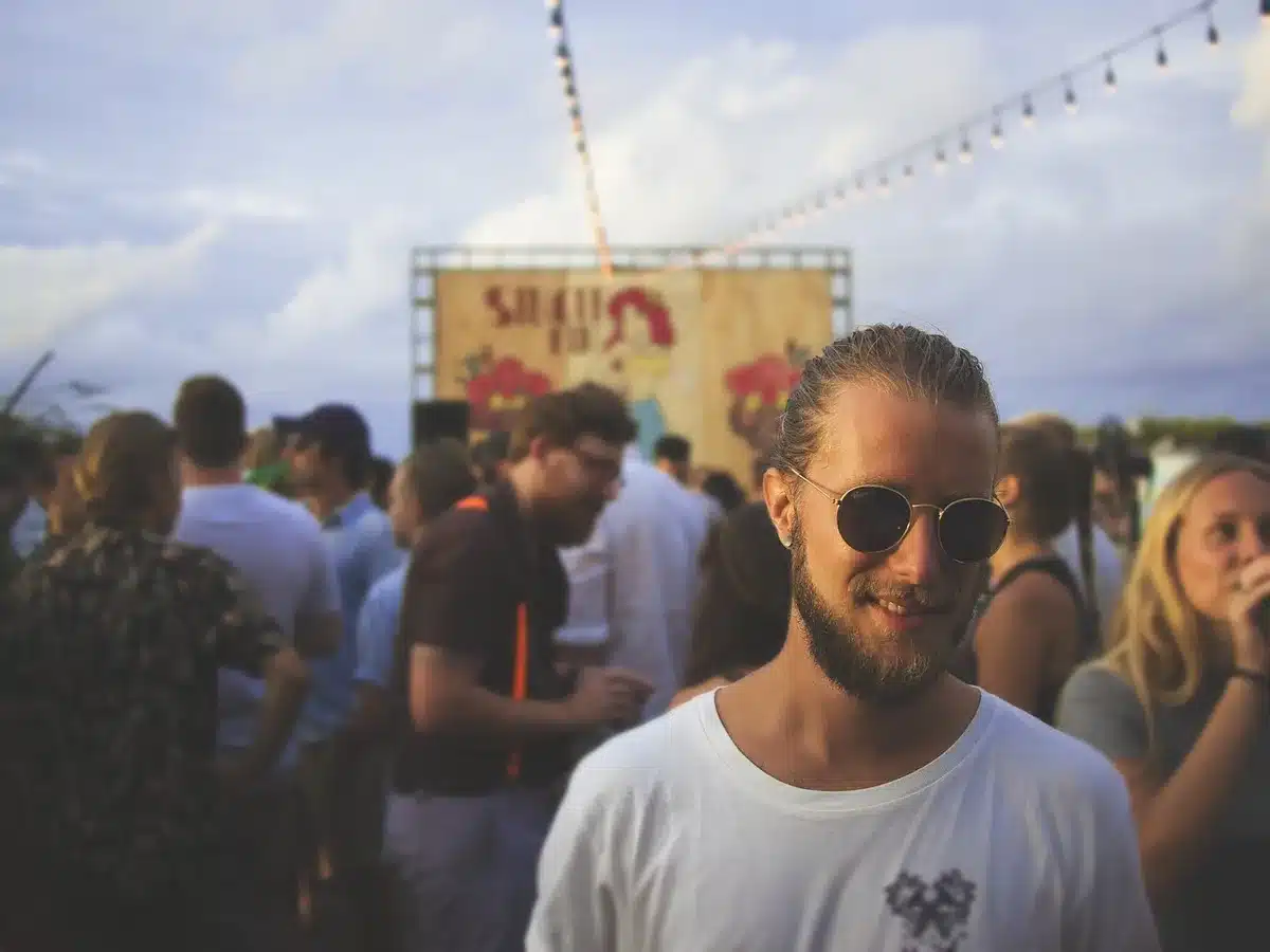 Festival crowd watching an outdoor stage performance